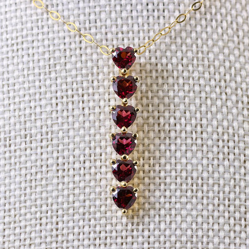 9Ct Gold 6 Heart Cut Garnets Bar Pendant