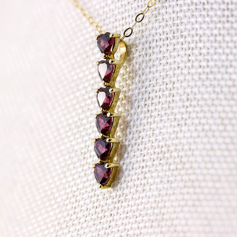 9Ct Gold 6 Heart Cut Garnets Bar Pendant