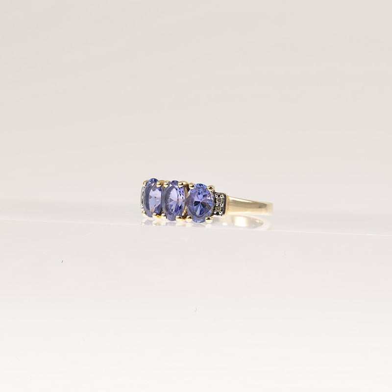 Tanzanite Trilogy Ring With Diamond Accents In 9Ct Gold — preloved 9ct gold, tanzanite | Sparklier Fine Jewellery
