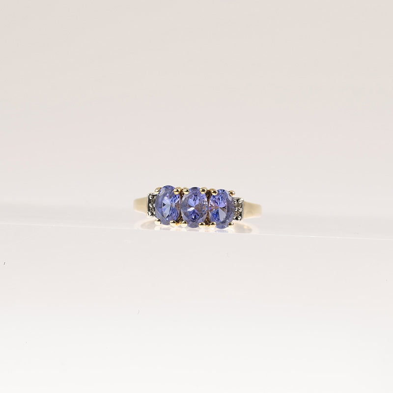 Tanzanite Trilogy Ring With Diamond Accents In 9Ct Gold — preloved 9ct gold, tanzanite | Sparklier Fine Jewellery