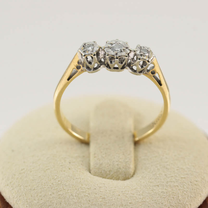18Ct Gold & Platinum Diamond Three Stone Ring — displayed on ring stand
