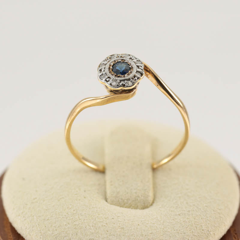 18Ct Gold & Platinum Diamond & Sapphire Halo Ring — displayed on ring stand