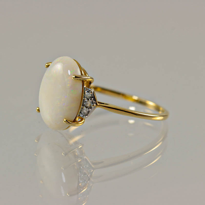 10Ct Gold Opal & White Sapphire Dress Ring — side profile showing claw setting and sapphire accents
