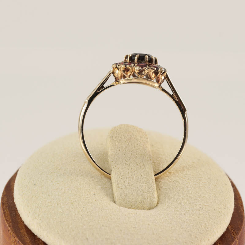 9Ct Gold Garnet Cluster Ring — back view on ring stand showing split shoulders