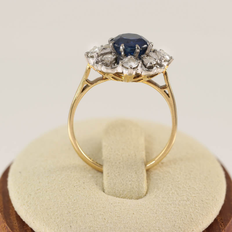 18Ct Gold & Platinum Sapphire & Diamond Flowerhead Cluster Ring — displayed on ring stand