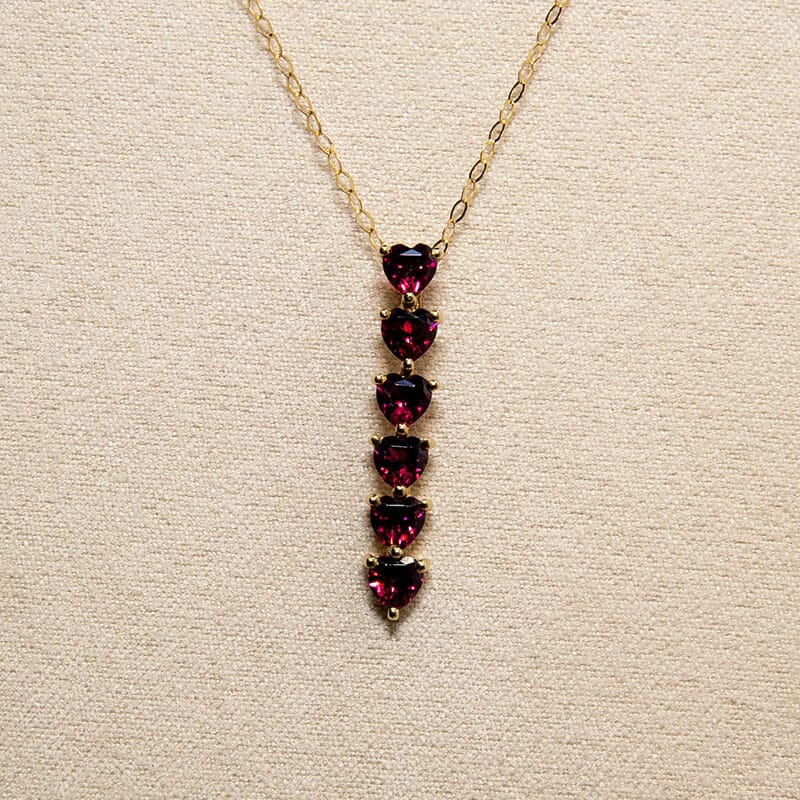 125-9ct-gold-6-heart-cut-garnets-bar-pendant